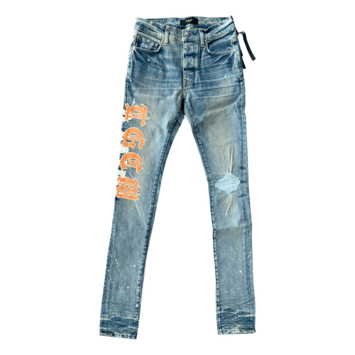 Amiri Clay Indigo T.G.C.W Distressed Logo Jeans - Morely TrendsAmiri Type here:)