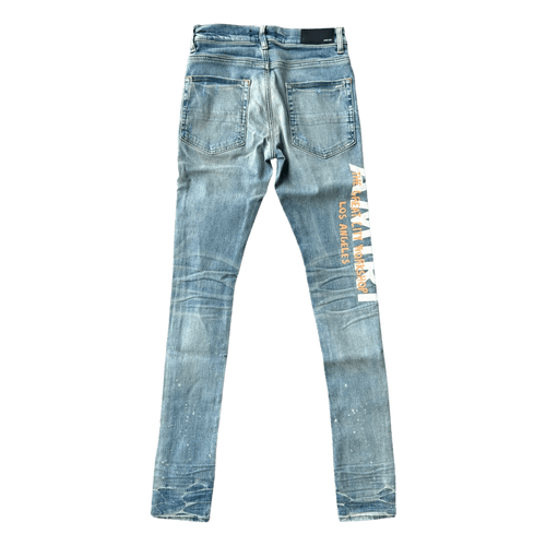 Amiri Clay Indigo T.G.C.W Distressed Logo Jeans - Morely TrendsAmiri Type here:)