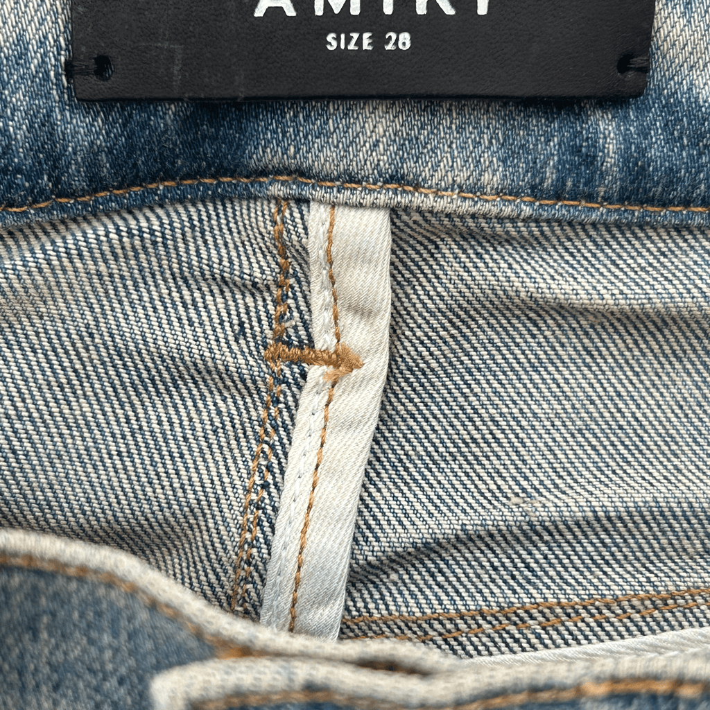 Amiri Clay Indigo T.G.C.W Distressed Logo Jeans - Morely TrendsAmiri Type here:)